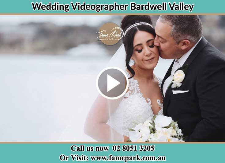 The Groom kiss the Bride's cheeks Bardwell Valley NSW 2207