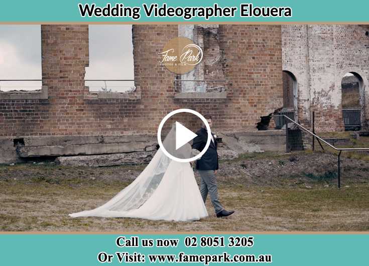 Bride and Groom looking at each other while walking at the ruinse Elouera NSW 2230