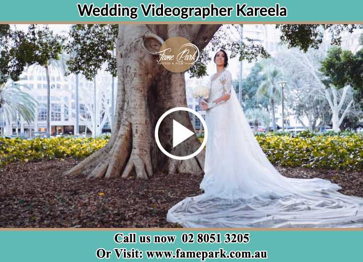 Bride already prepared while holding a bouquet of flowers at the park Kareela NSW 2232