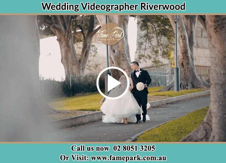 Bride and Groom looking at each other while walking in the park Riverwood NSW 2210