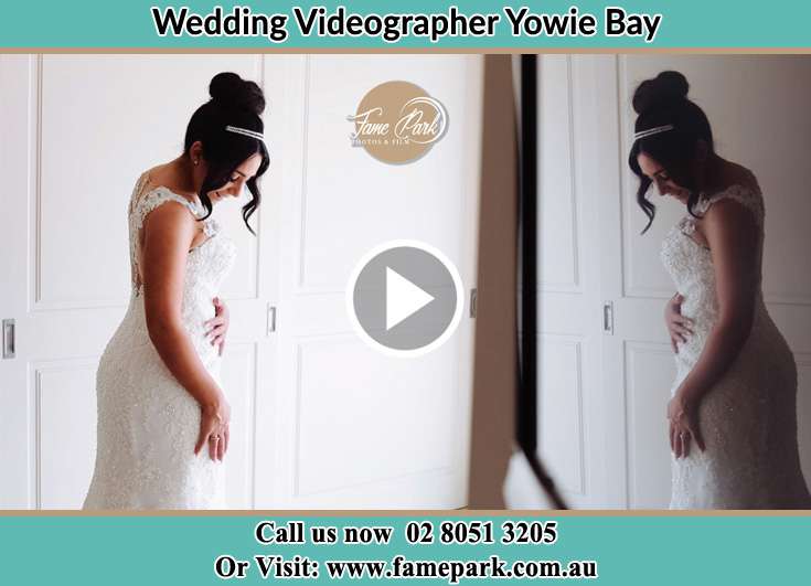 The Bride looking at her weddig gown Yowie Bay NSW 2228